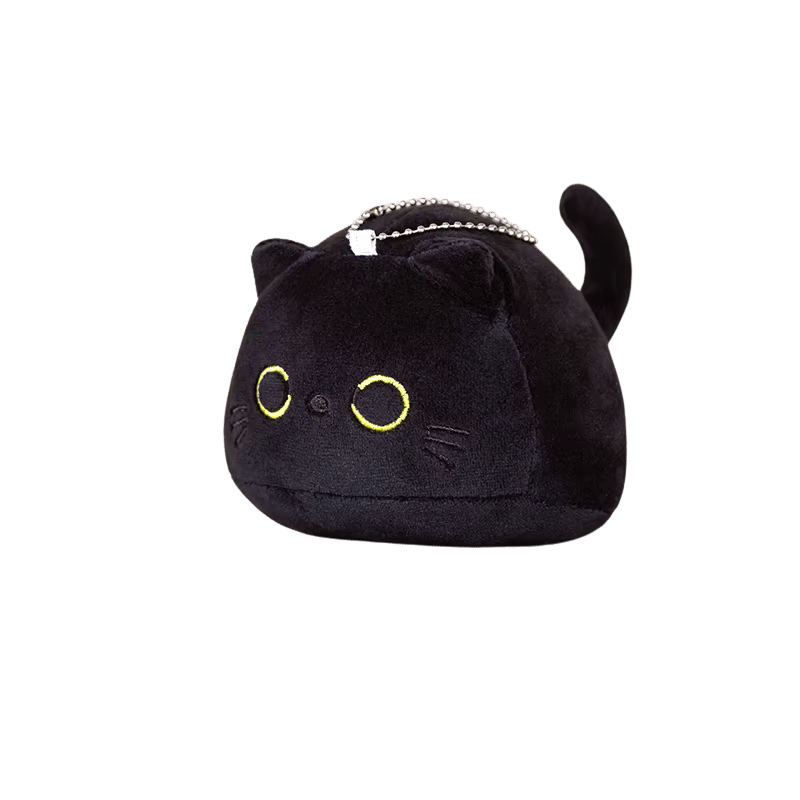 Close-up of face: black plush with embroidered whiskers and small smile